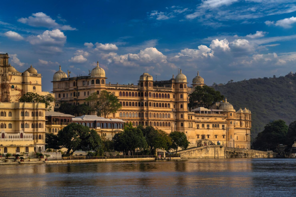 lake-pichola-old-city-palace-lake-palace-amazing-beautiful-view-from-ambrai-ghat-udaipur-rajasthan-india_136354-12580